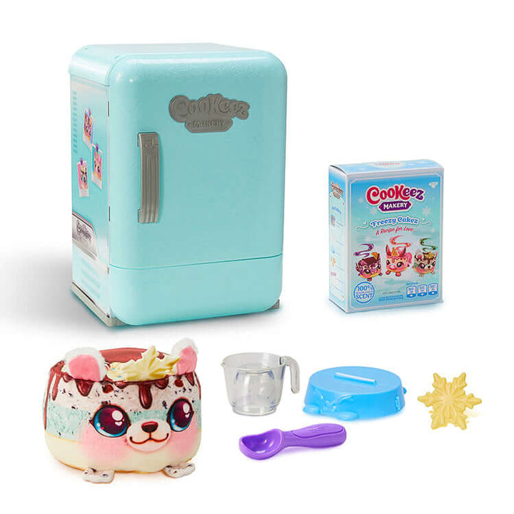 Cookeez Makery Freezy Cakez Playset with fridge, plush toy, ice cream sachet, and accessories for kids' creative play.