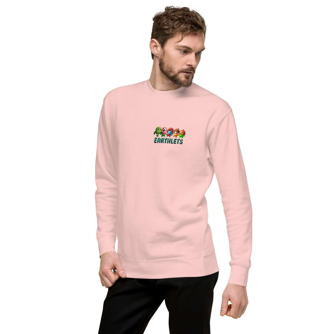 Man wearing Earthlets Unisex Premium Sweatshirt in pink, showcasing modern streetwear style.