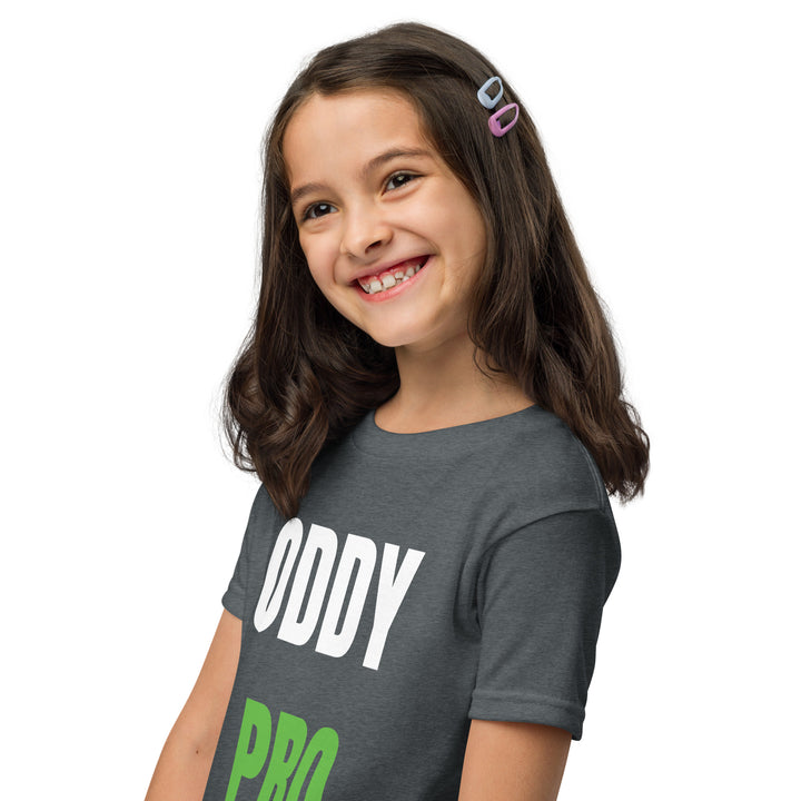 A smiling girl wearing an Oddy Pro Youth t-shirt, showcasing the modern fit and vibrant design.