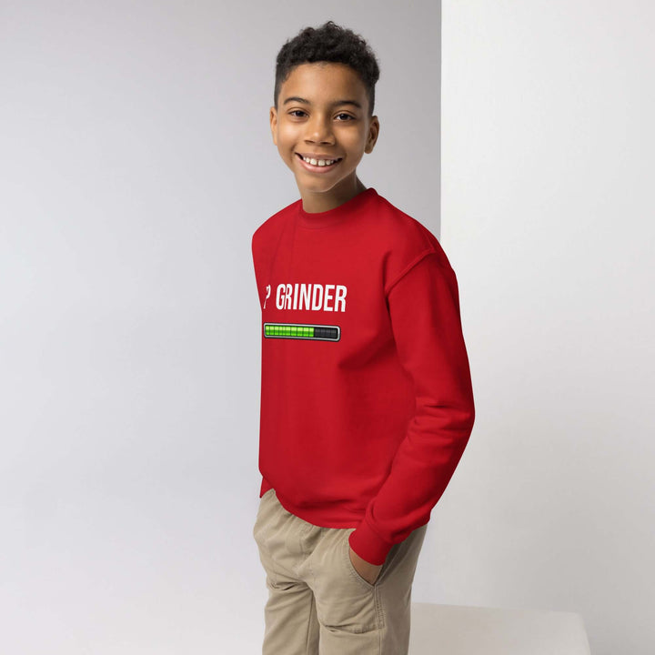 XP Grinder Youth crewneck sweatshirt in red worn by a smiling boy, perfect for adventures and casual lounging.